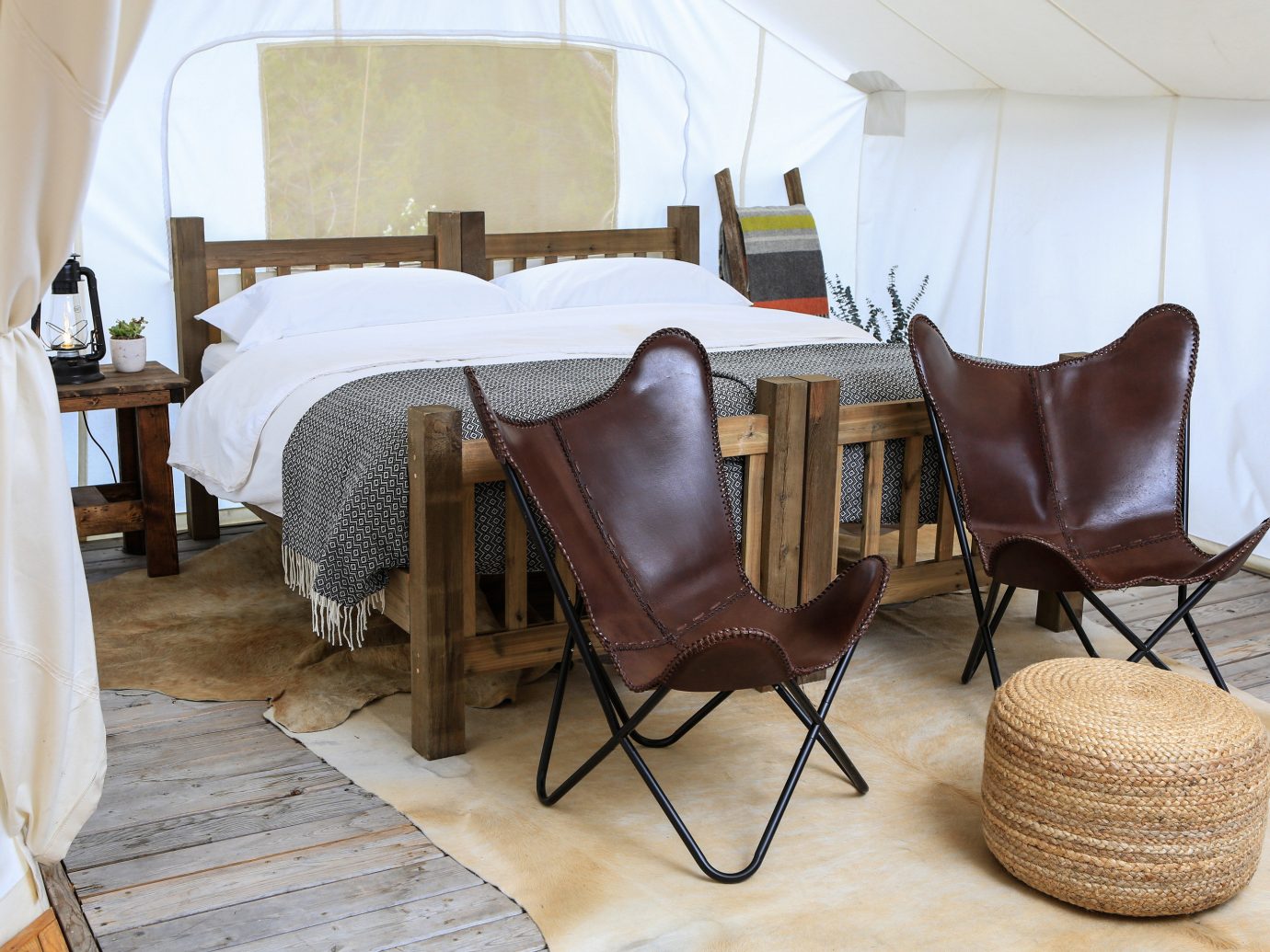 Glamping Hotels Outdoors + Adventure Trip Ideas indoor floor wall chair room property Living furniture living room interior design home table cottage Suite wood Villa estate bed