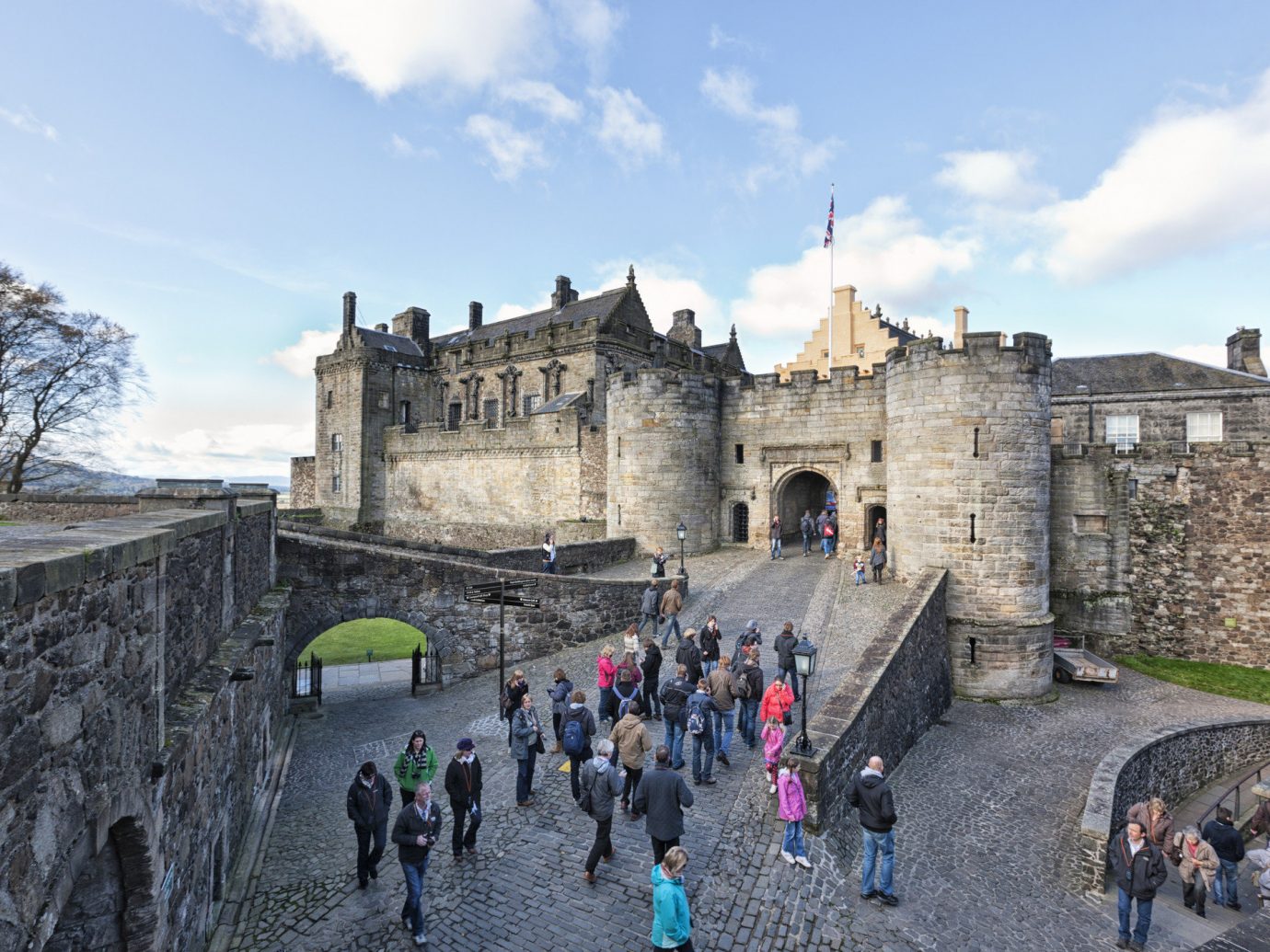 Landmarks Offbeat sky outdoor castle wall building fortification château historic site medieval architecture people group history tours tourist attraction tourism middle ages palace stone several crowd