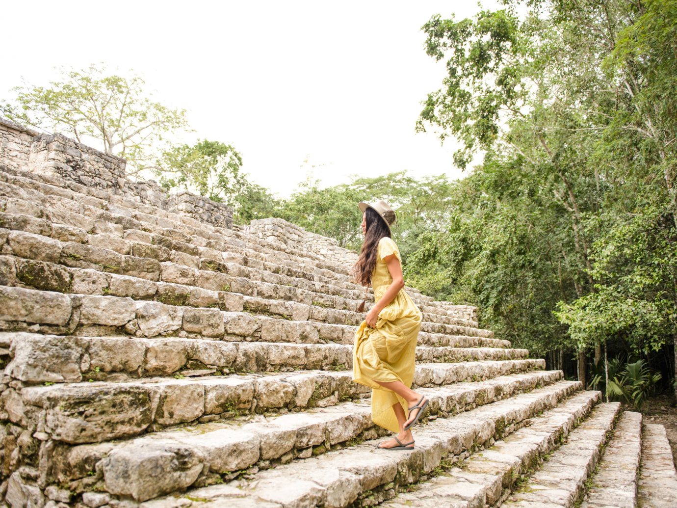 City Mexico Trip Ideas Tulum outdoor tree rock temple outdoor structure girl tourism sky grass leisure archaeological site recreation stone