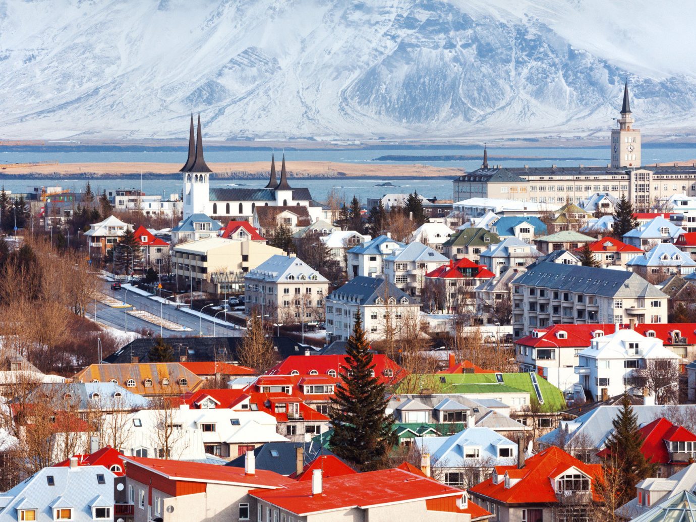 Boutique Hotels Health + Wellness Hotels Iceland Meditation Retreats Offbeat Outdoors + Adventure Reykjavík Road Trips Romance Travel Tips Trip Ideas Yoga Retreats outdoor snow Town City mountain human settlement Winter cityscape Harbor aerial photography panorama