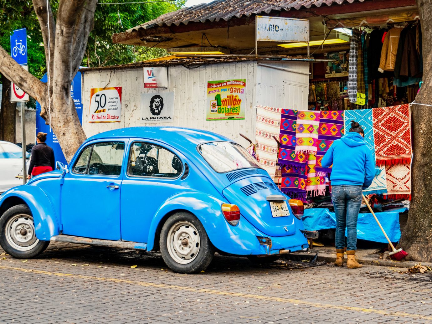 City Mexico City Trip Ideas outdoor building car motor vehicle vehicle volkswagen beetle automotive design Classic blue vintage car subcompact car street antique car parked compact car volkswagen automotive exterior