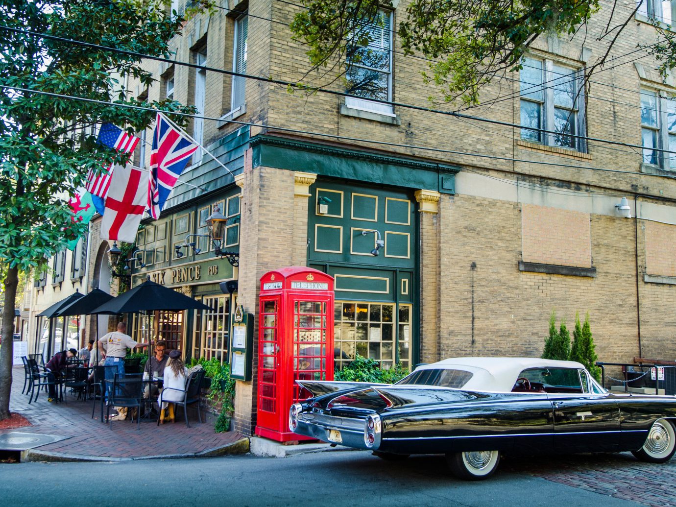 Corner restaurant and vintage car in Savannah, GA