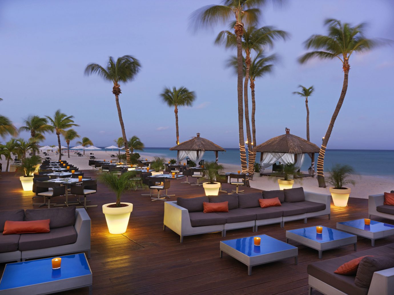 Aruba Bar Beachfront Dining Drink Eat Hotels Tropical tree sky Resort vacation palm estate arecales Beach caribbean condominium Villa Sea furniture plant
