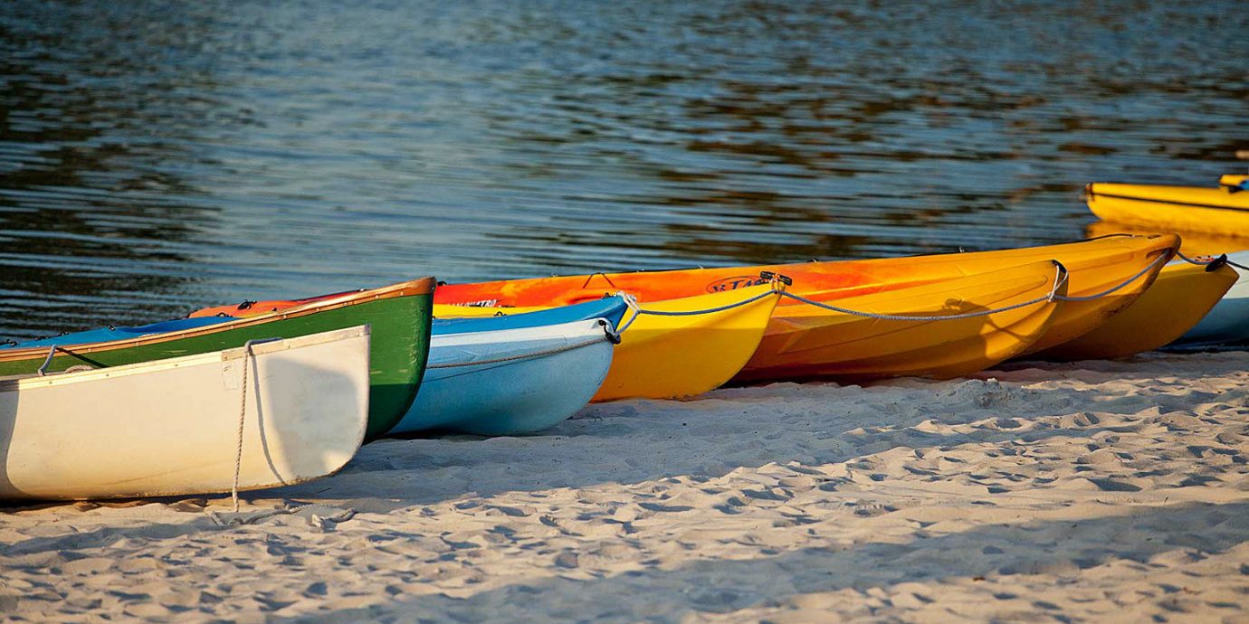 Adventure Beach Outdoors water Boat vehicle kayak boating watercraft rowing canoe Sea watercraft sports equipment kayaking paddle sea kayak surfing equipment and supplies dinghy orange sand
