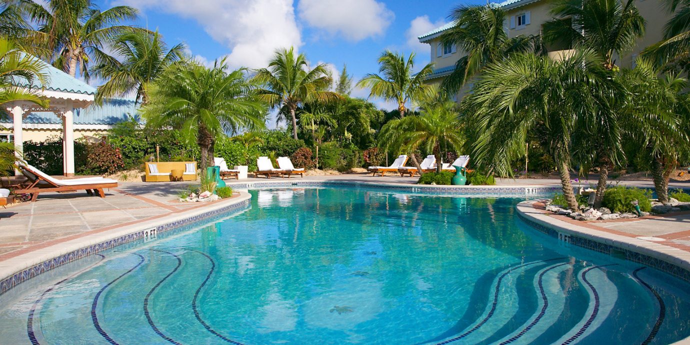 All-Inclusive Resorts Beachfront Boutique Luxury Pool Resort tree sky ground swimming pool property leisure caribbean resort town Villa Lagoon backyard blue palm