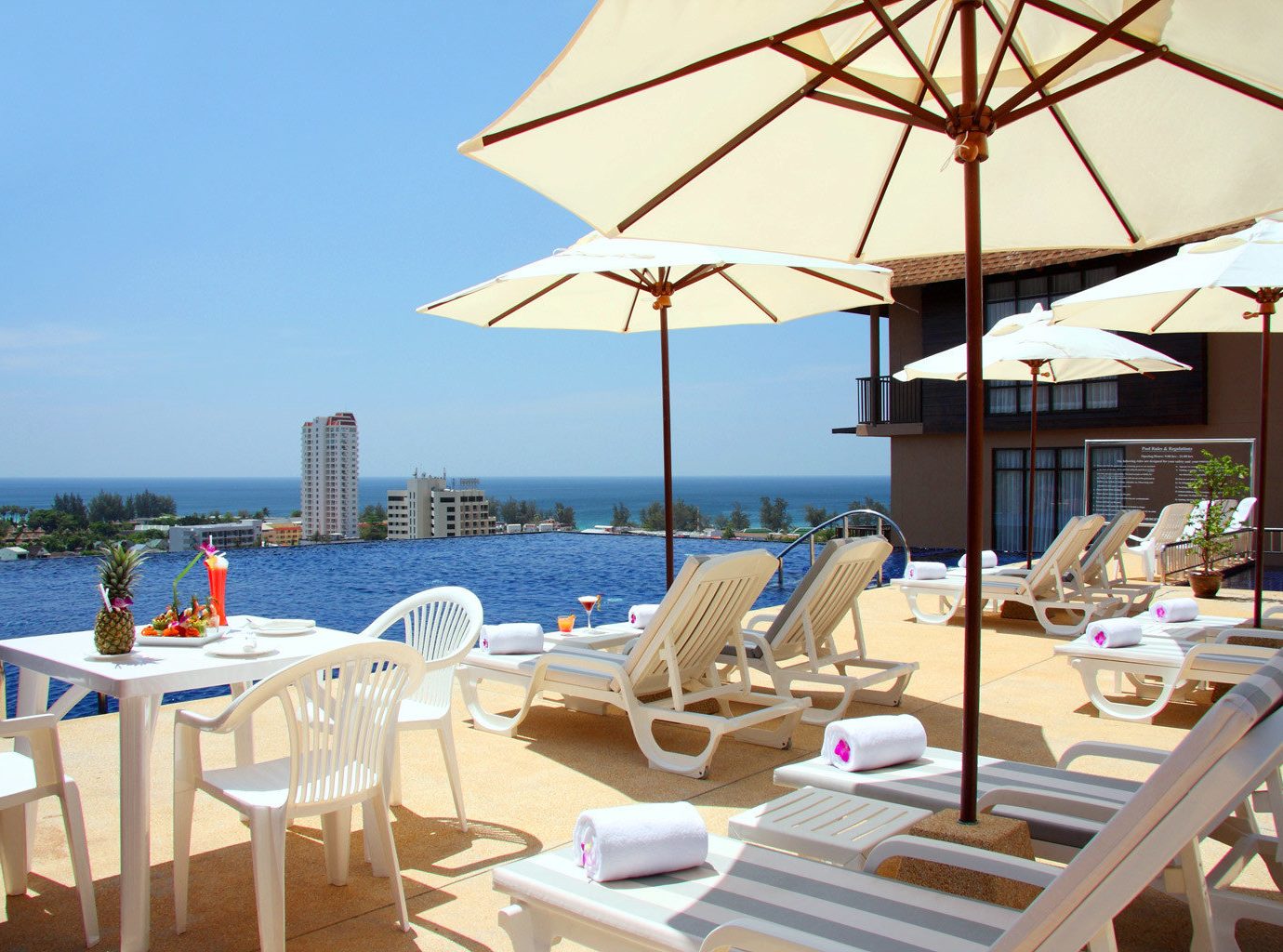 B&B Beachfront Deck Pool Scenic views sky chair restaurant Resort Villa cottage set day