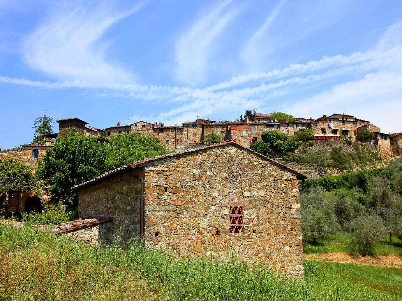 Italy Trip Ideas sky property Village rural area cottage house cloud tree grass home mountain farmhouse estate meadow facade field historic site hill landscape roof plant grassland