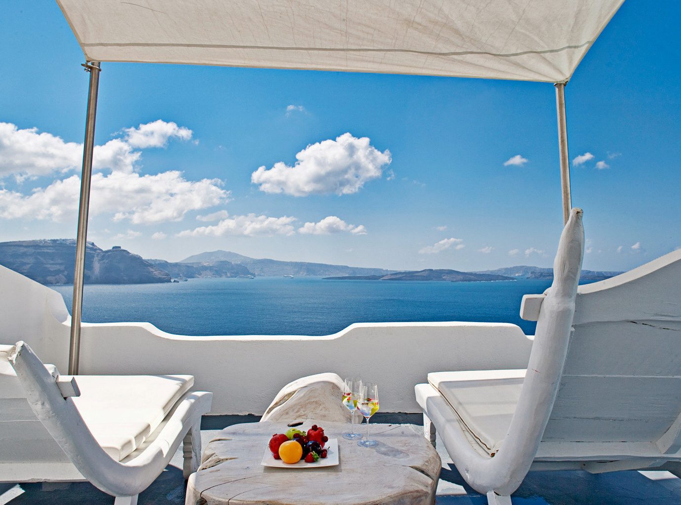 Balcony Bedroom Classic Elegant Hotels Island Luxury Romantic Scenic views Trip Ideas Waterfront sky blue Sea wind day