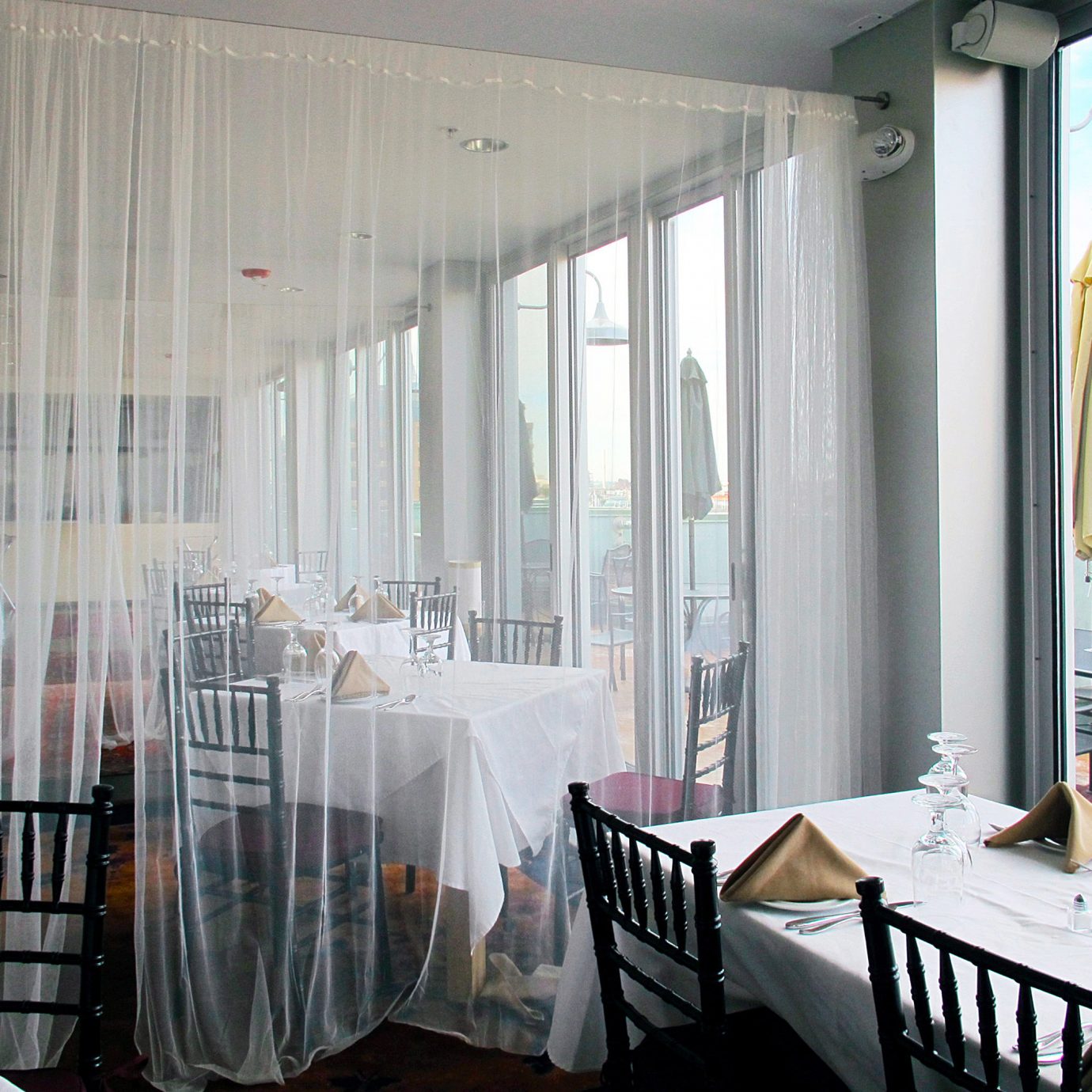 Balcony Dining Drink Eat Inn Patio Terrace property chair curtain home window treatment textile living room