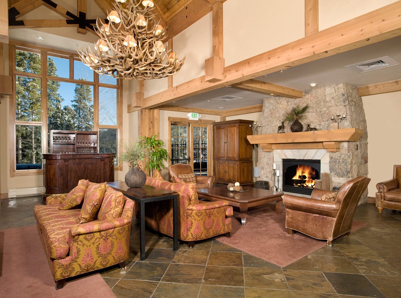 Bar Fireplace Lodge Lounge Rustic Scenic views sofa living room property home fire house hardwood cottage mansion Villa farmhouse wood flooring
