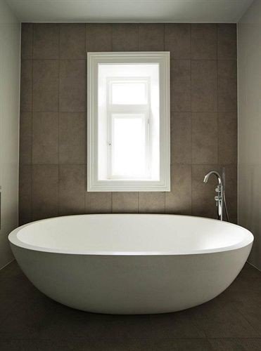 bathroom bathtub plumbing fixture sink bidet toilet flooring tub water basin tile tiled Bath stone