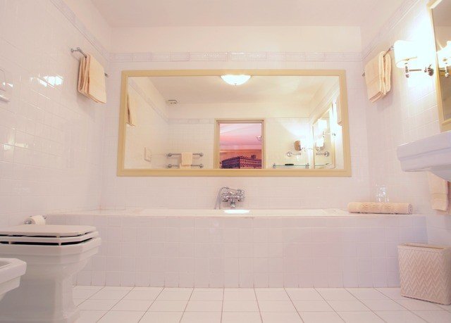 bathroom toilet property sink flooring plumbing fixture bathtub tub Bath tile tiled