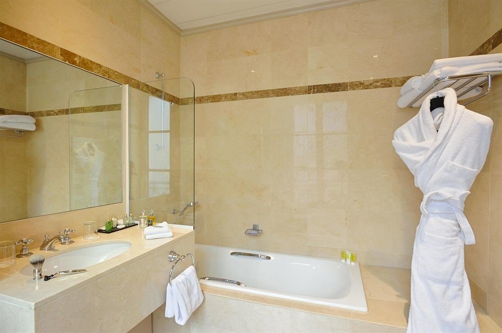 bathroom property sink plumbing fixture home tub bathtub Bath tan