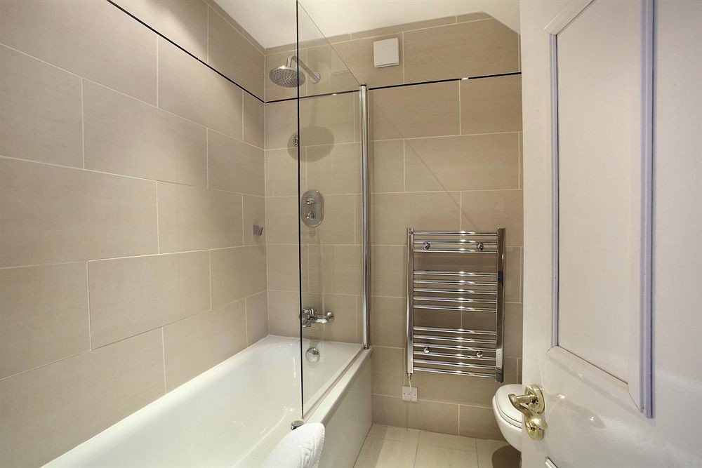 bathroom property toilet plumbing fixture Bath tiled