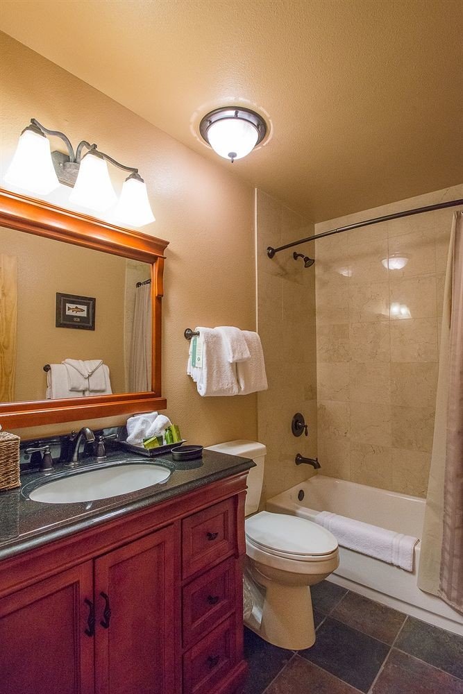bathroom property sink home cottage cabinetry Suite tile tan Bath