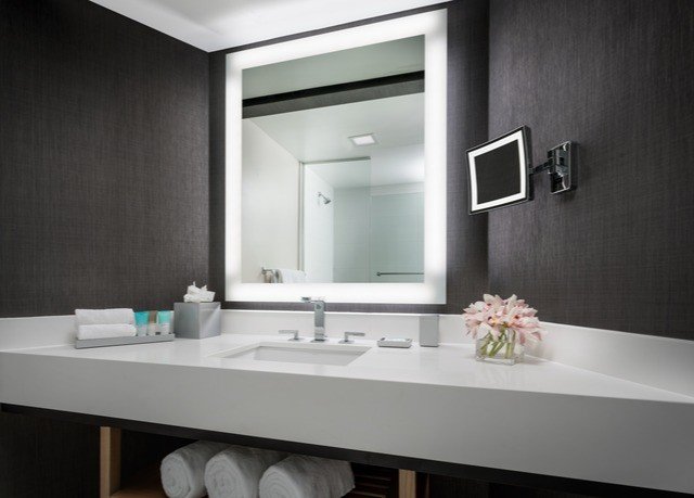 bathroom mirror sink countertop lighting plumbing fixture bathroom cabinet
