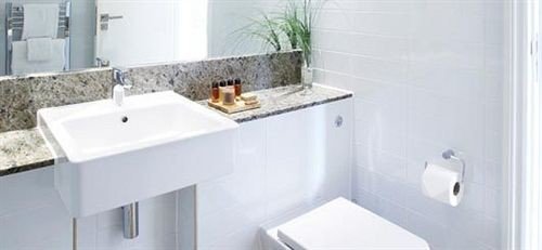 bathroom sink property bidet plumbing fixture toilet white bathtub vessel water basin tile