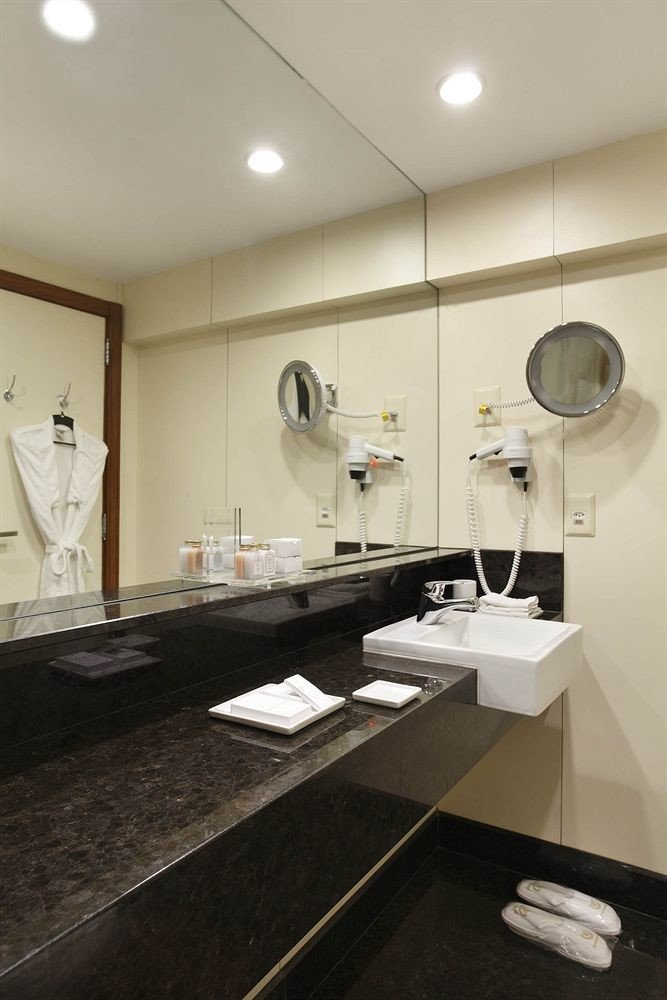 bathroom sink mirror property counter home lighting flooring countertop plumbing fixture long