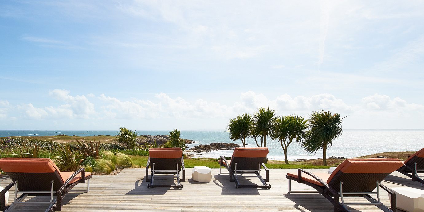 Beachfront Lounge Outdoors Patio Resort Scenic views sky ground property Beach walkway vehicle dock Villa Sea sandy