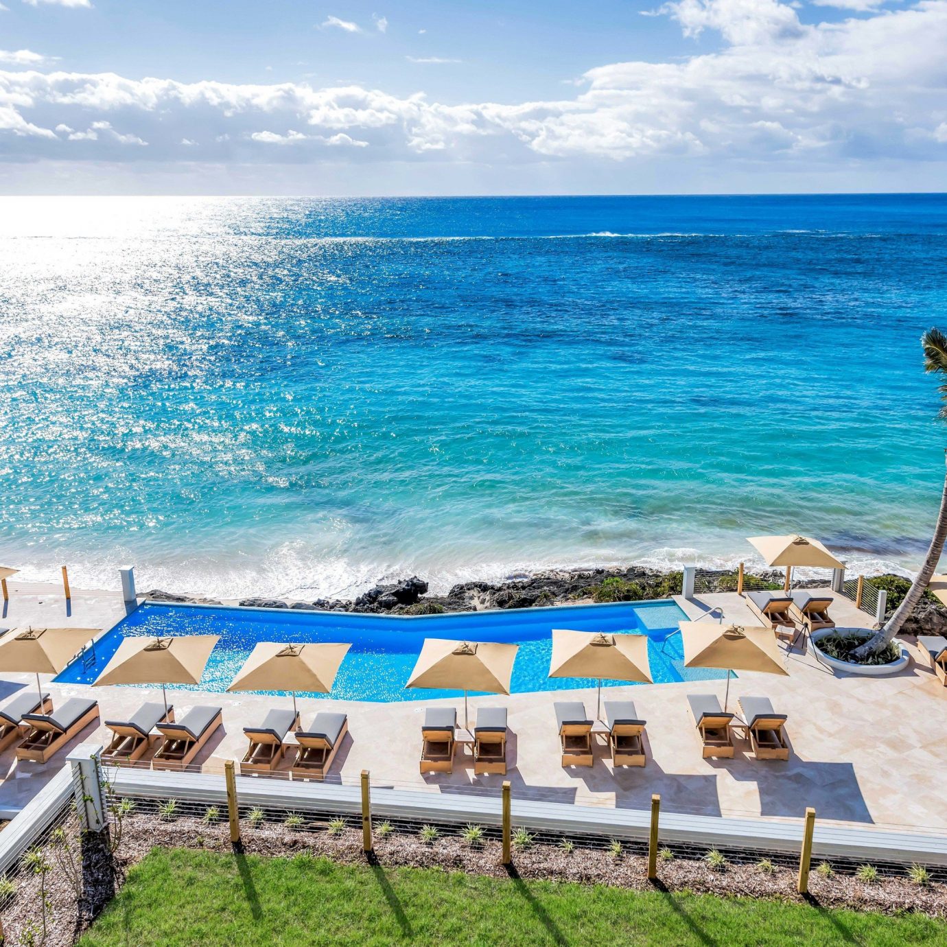 sky water chair leisure Beach lawn shore Sea Ocean Coast caribbean swimming pool Resort cape Deck swimming sandy