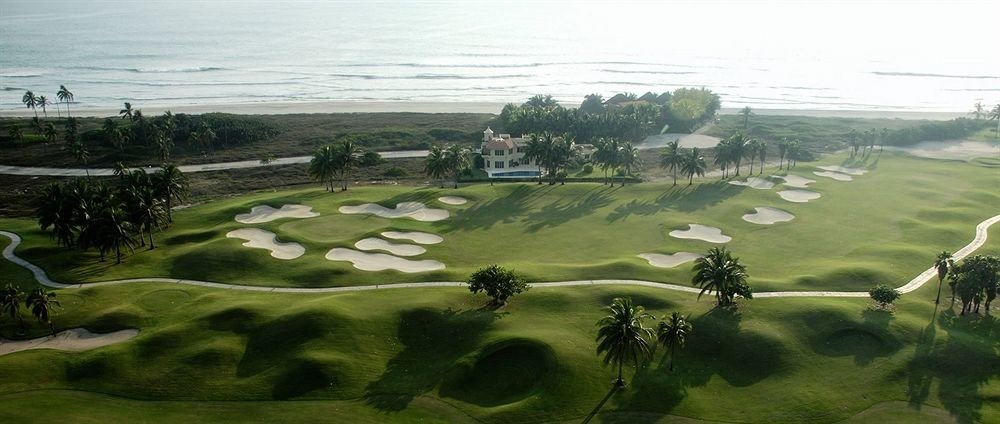 Beach Golf Honeymoon Resort Sport Waterfront grass structure plain ecosystem Nature grassland sport venue aerial photography golf course hill golf club paddy field field rural area landscape Terrace bird's eye view plateau meadow lawn agriculture race track plant shore highway