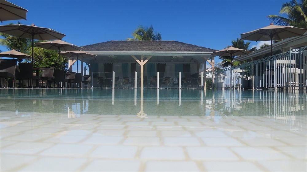 building house property swimming pool walkway Resort home condominium Villa Beach mansion