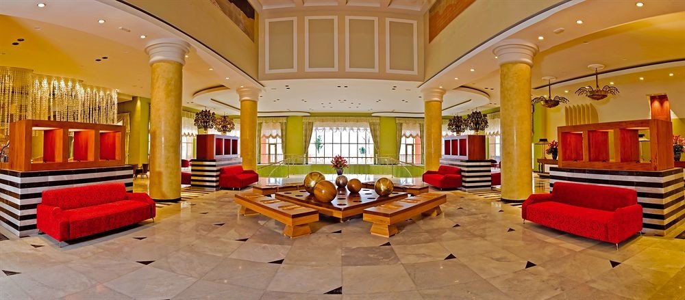 Beachfront Family Lobby Lounge Tropical yellow property building red Resort mansion palace living room recreation room Villa bright colored