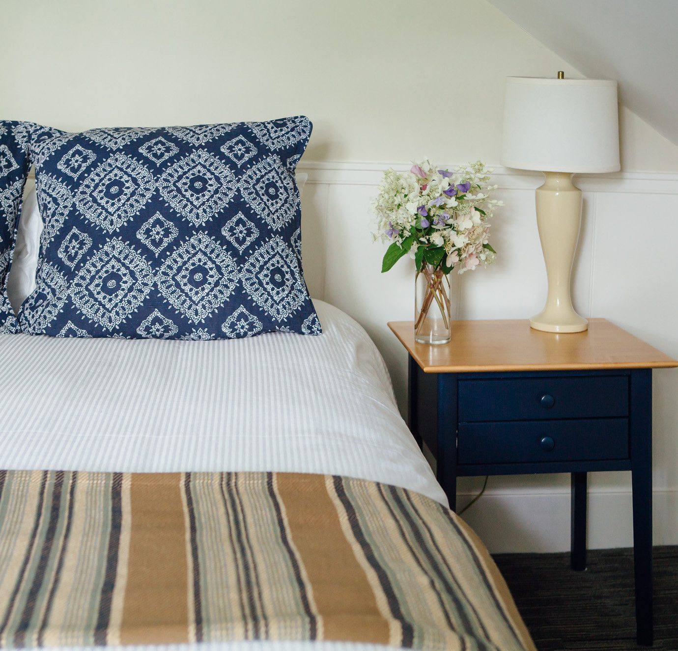 Bedroom pillow duvet cover bed sheet hardwood white bed frame cottage textile lamp