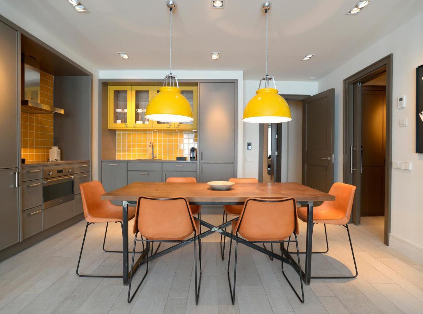 property living room home hardwood Kitchen cabinetry orange condominium Bedroom