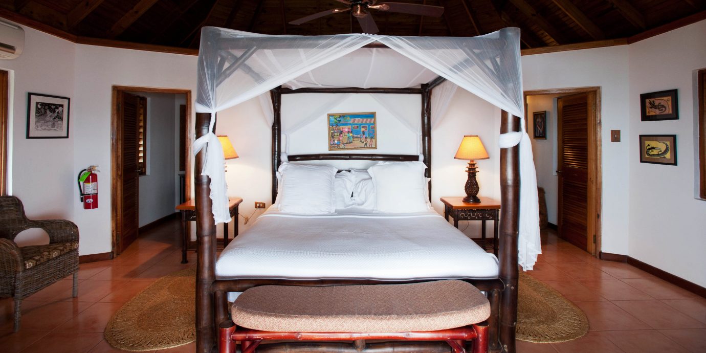 Bedroom Romance Romantic Rustic Sea Tropical Waterfront property house home cottage living room Suite Villa Resort