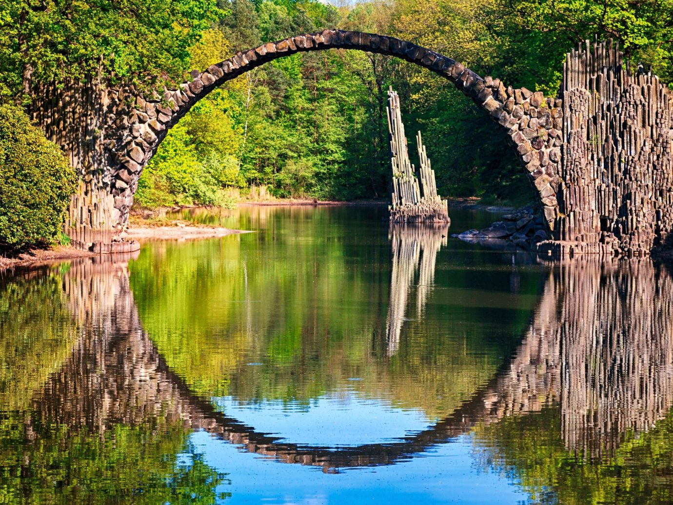 Trip Ideas tree outdoor grass water reflection River body of water bridge Lake woody plant flower pond Nature waterway autumn surrounded wetland stream park way arch wooded