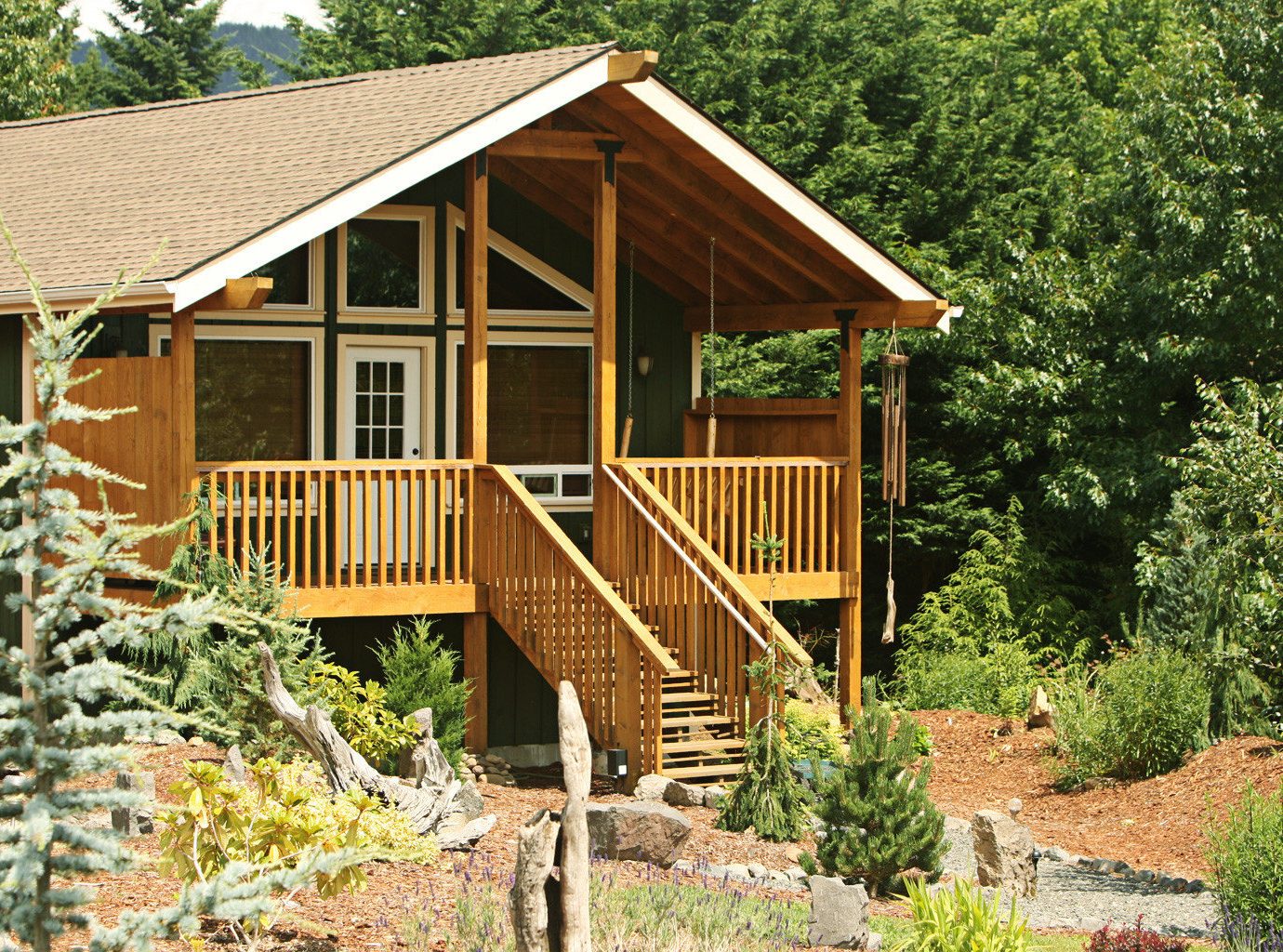 Cabin Exterior tree house building wooden log cabin rock shed yellow outdoor structure cottage Garden home backyard hut bushes surrounded