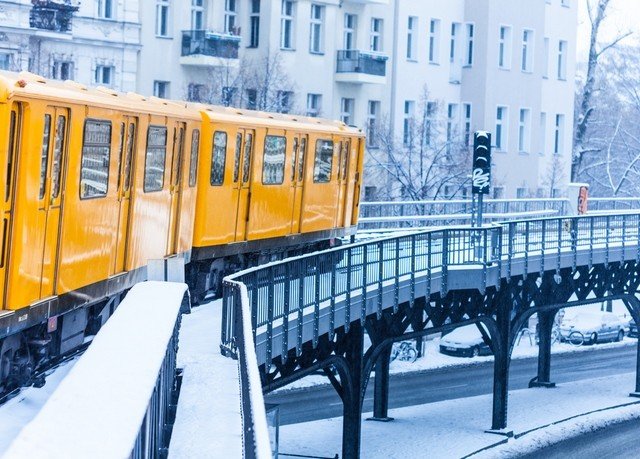 yellow transport metropolitan area train vehicle public transport City Winter snow rolling stock season orange traveling