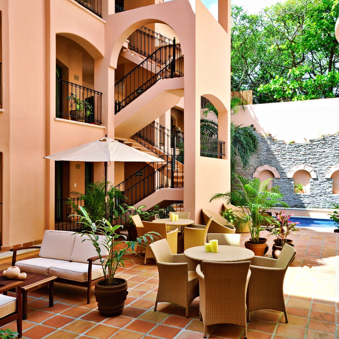 Dining Lounge Patio chair property home Resort condominium Lobby living room Villa Courtyard