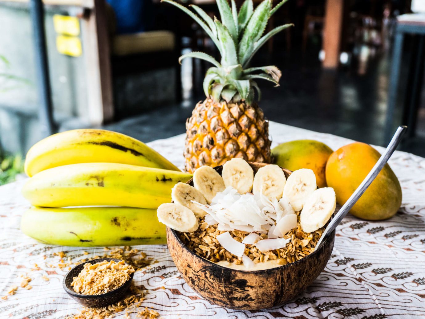 Influencers + Tastemakers Travel Shop Trip Ideas table ananas food fruit pineapple banana banana family produce vegetarian food vegetable bromeliaceae superfood fresh