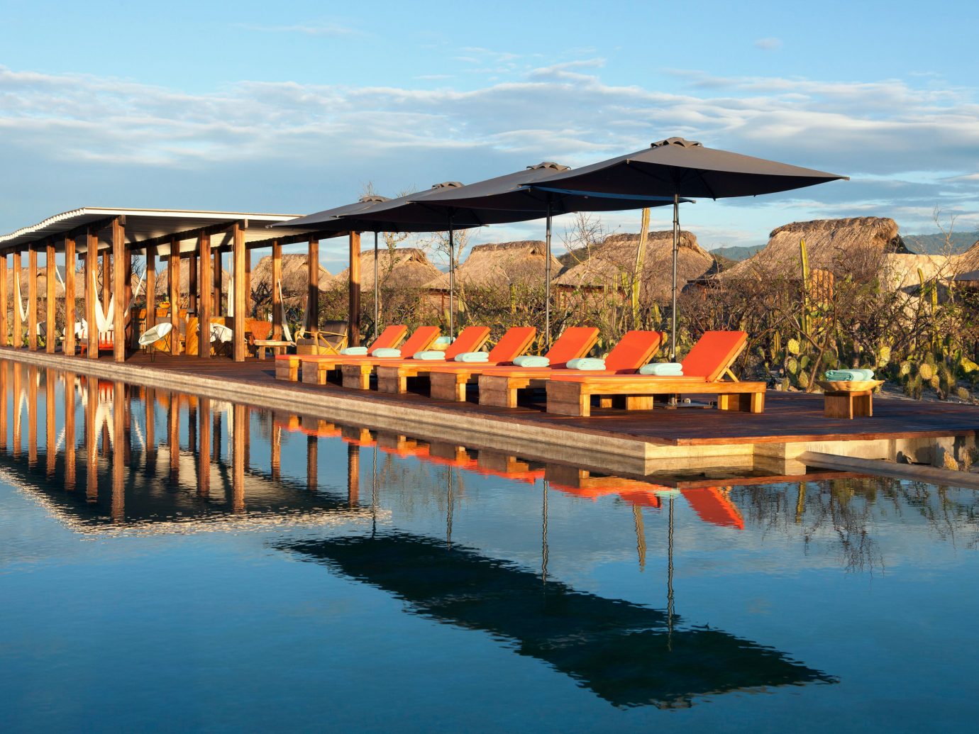 Deck Lounge Luxury Pool sky water leisure mountain scene swimming pool long Resort orange Sea Lake traveling