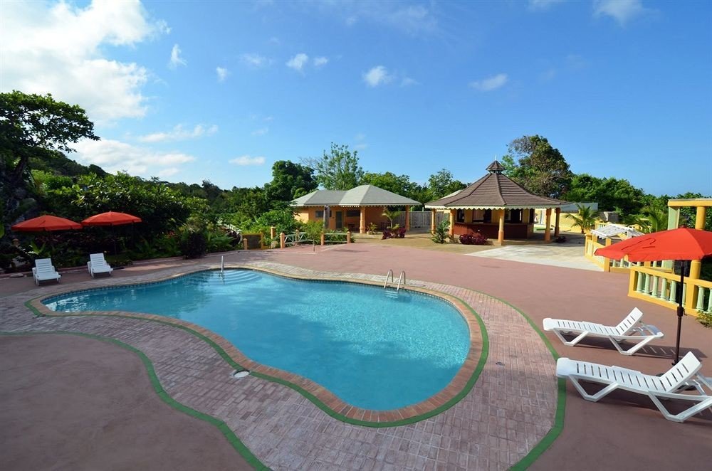 Outdoors Pool sky tree chair swimming pool property Resort leisure lawn Villa backyard condominium Deck set lined