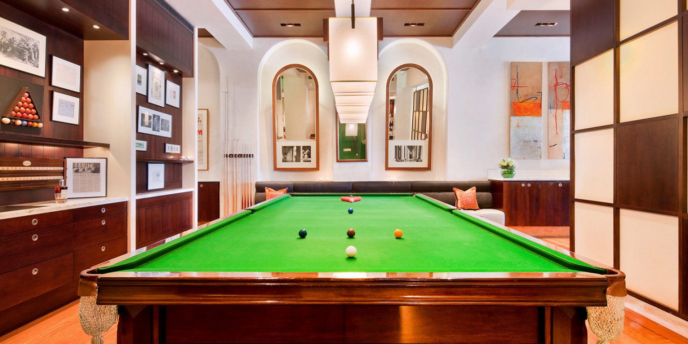Entertainment Play Resort pool table poolroom billiard room pool ball recreation room carom billiards cue sports green billiard table scene indoor games and sports sports games gambling house
