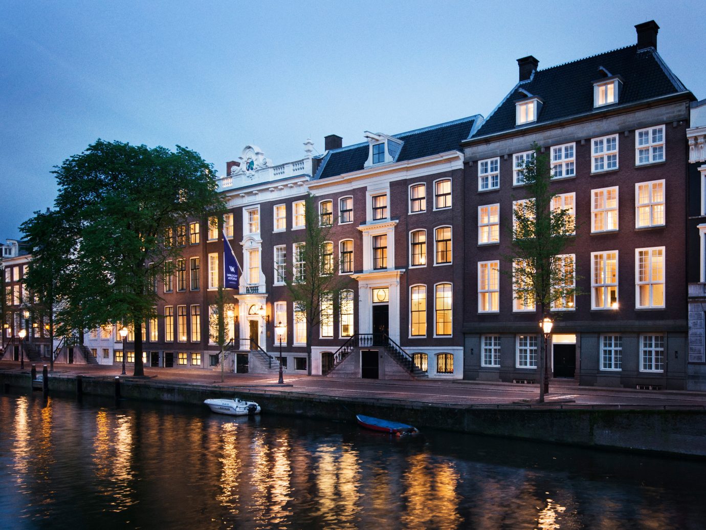 Amsterdam Architecture Buildings City Elegant Exterior Family Hotels Luxury Romantic The Netherlands Waterfront sky building outdoor water Canal waterway body of water Town landmark reflection house evening estate cityscape several