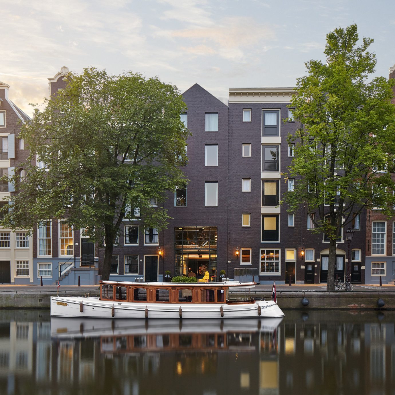 Amsterdam Boutique Hotels Hotels The Netherlands Trip Ideas outdoor sky water Canal City neighbourhood landmark Town urban area tower block waterway residential area reflection house cityscape human settlement Architecture Downtown River condominium facade town square skyline