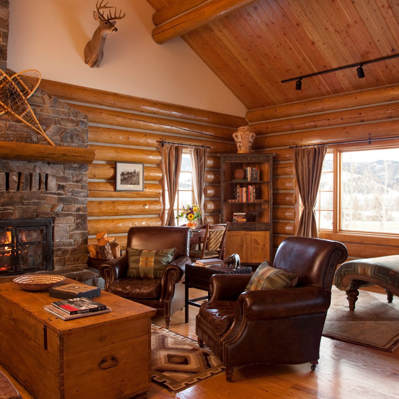 Fireplace property log cabin living room fire home house cottage hardwood farmhouse wood flooring stone