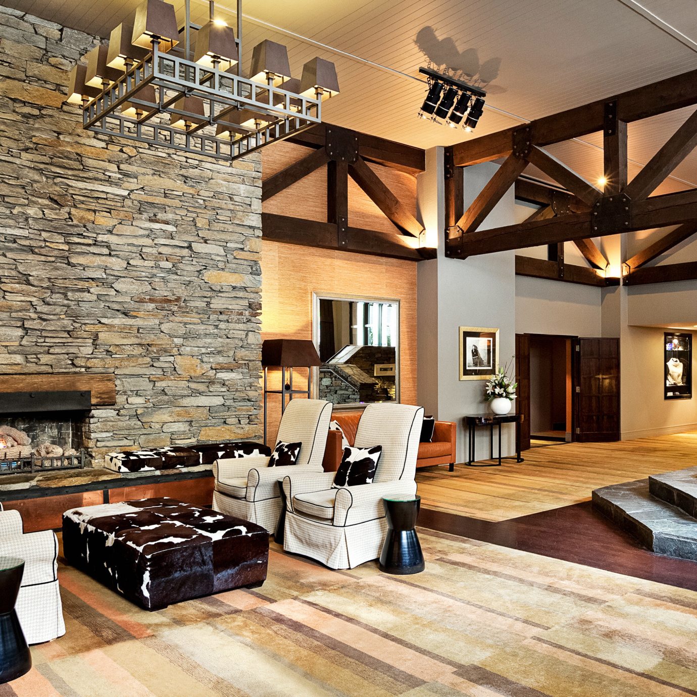 Fireplace Lounge property living room hardwood home farmhouse wood flooring flooring cottage mansion Villa Lobby loft stone