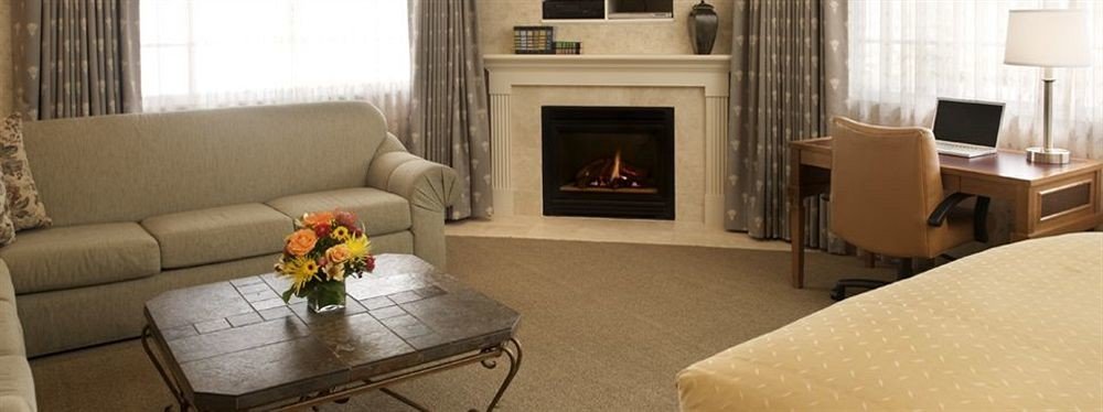 Lounge Suite sofa living room property home Fireplace cottage hardwood curtain Villa condominium flat containing
