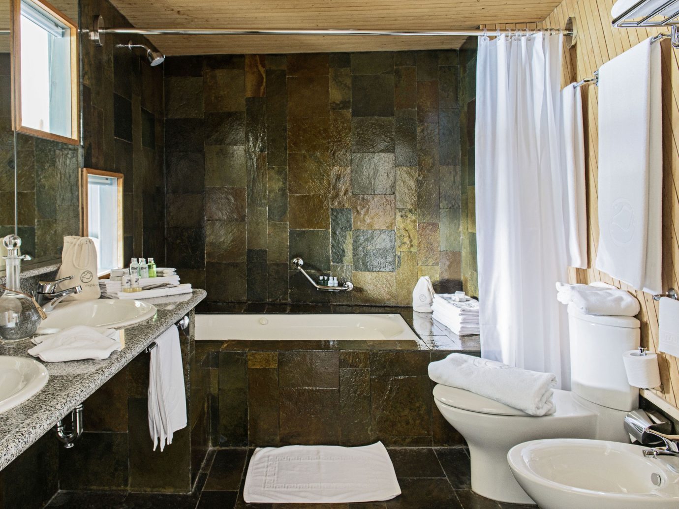 All-Inclusive Resorts Hotels Luxury Travel indoor bathroom sink room window property estate interior design home floor Suite counter Design toilet tub bathtub Bath tiled