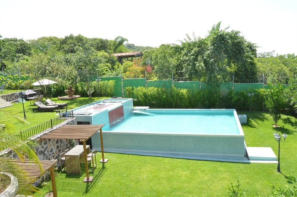 grass tree swimming pool property backyard lawn landscape architect Villa outdoor structure yard Garden lush