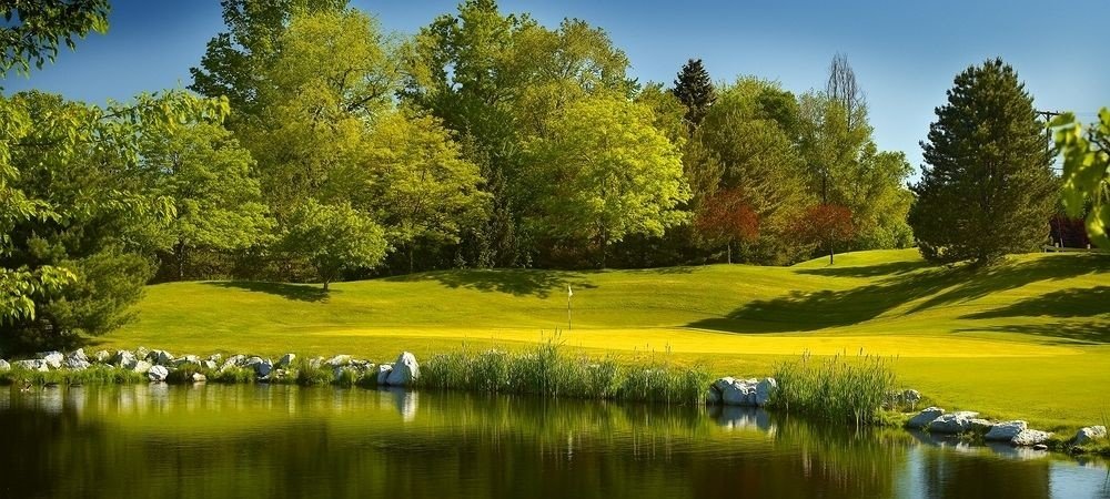 Golf Nature Outdoors Sport tree water grass sky River structure grassland sport venue golf course Lake meadow golf club lawn surrounded pond