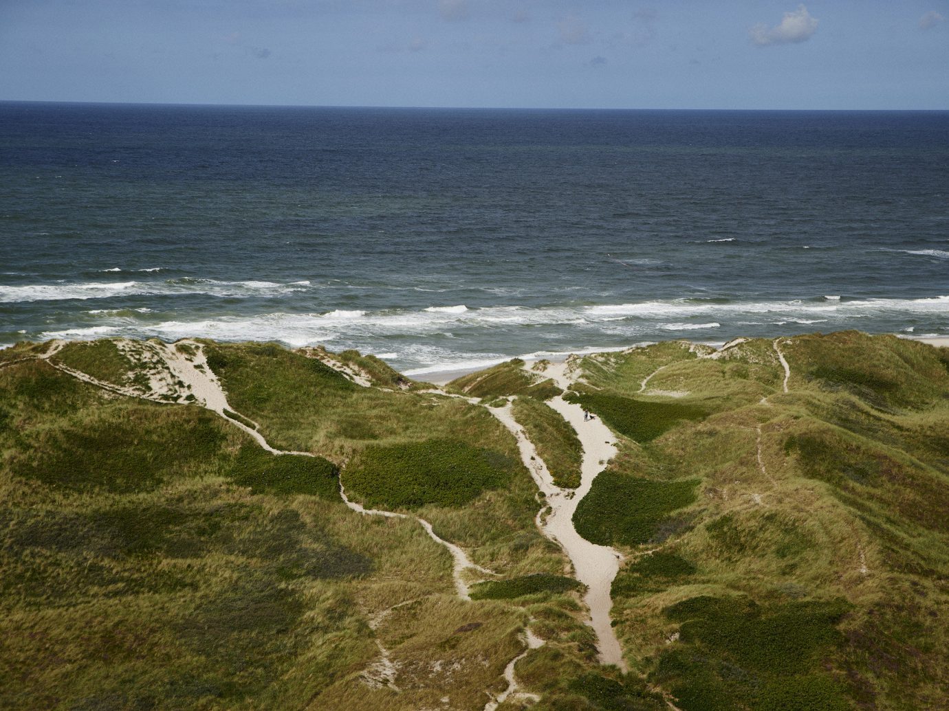 Beach dunes grass Ocean ocean view path sand Travel Tips outdoor water Coast shore Sea body of water Nature cliff horizon wind wave wave terrain cape rock bay wind cove aerial photography