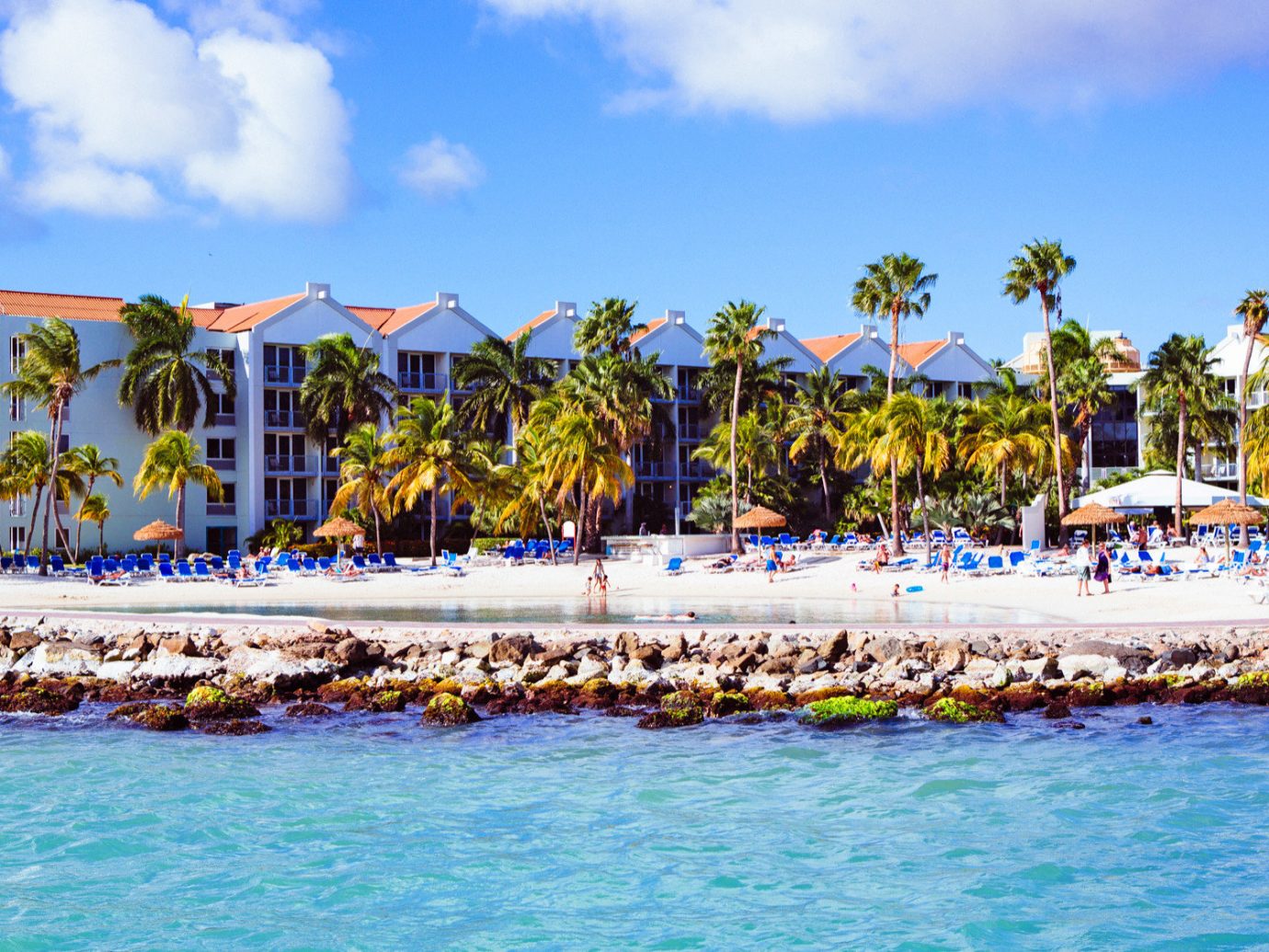 Architecture Aruba Beachfront Buildings Exterior Grounds Hotels sky outdoor water Beach leisure Resort vacation Sea caribbean swimming pool Water park bay amusement park Lagoon Harbor Island park lined swimming colorful sandy
