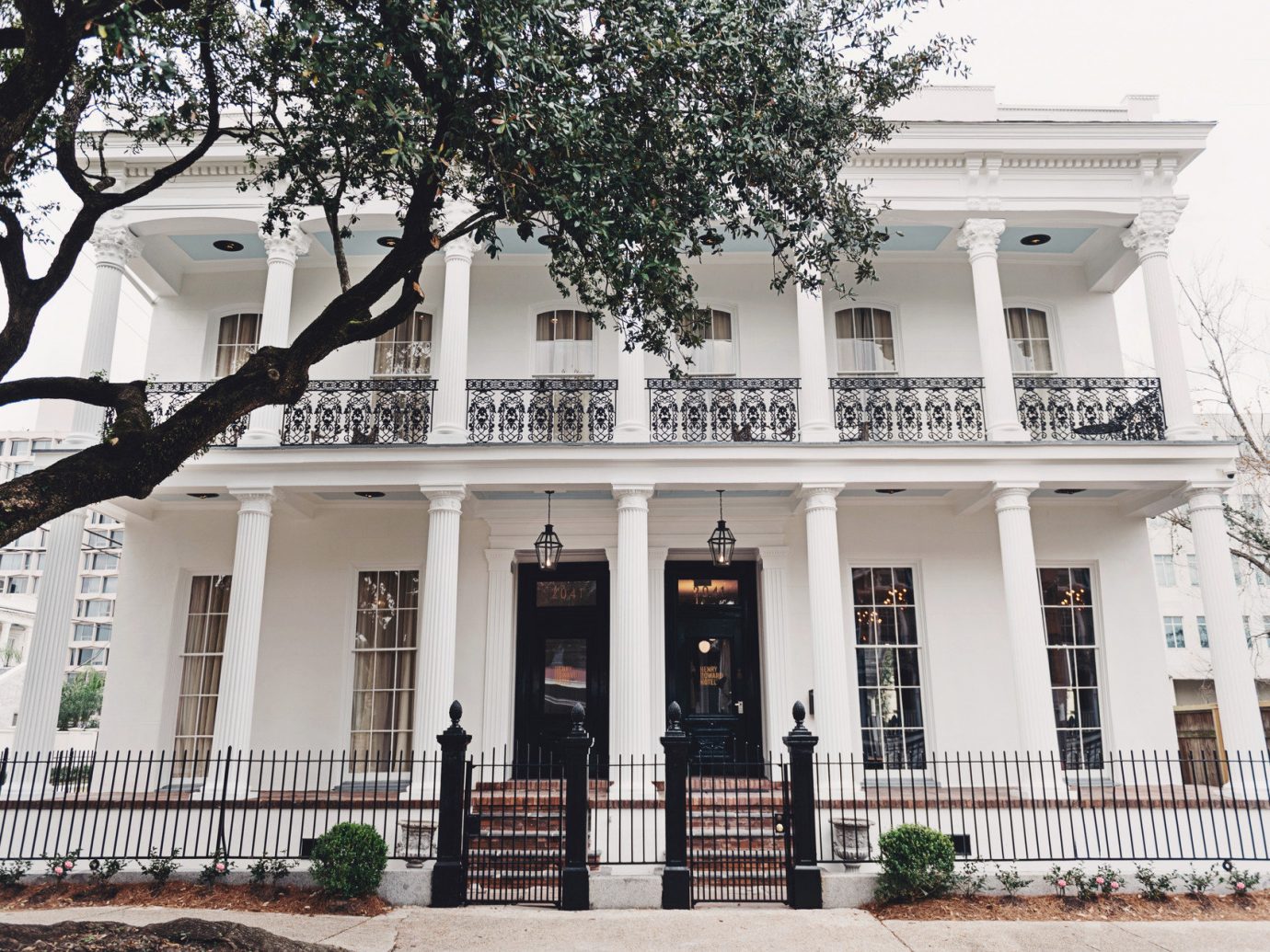 Boutique Hotels Food + Drink Girls Getaways Hotels New Orleans Trip Ideas Weekend Getaways tree property outdoor building neighbourhood house Architecture home estate facade plaza Courtyard mansion condominium palace