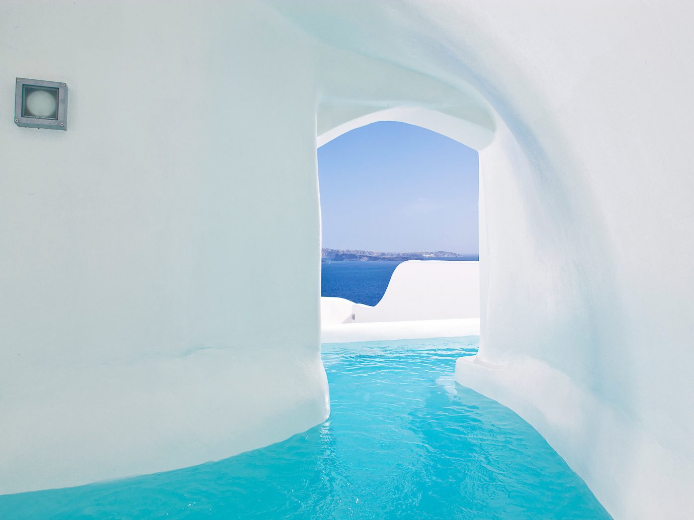 Bedroom Elegant Greece Historic Honeymoon Hot tub/Jacuzzi Hotels Luxury Romance Romantic Santorini Waterfront water blue swimming pool ice hotel
